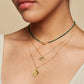 Cradled in Protection Gold and Emerald Hamsa Amulet Necklace